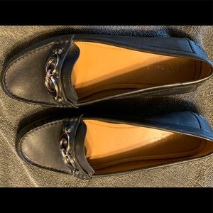 Coach black leather slip ons.